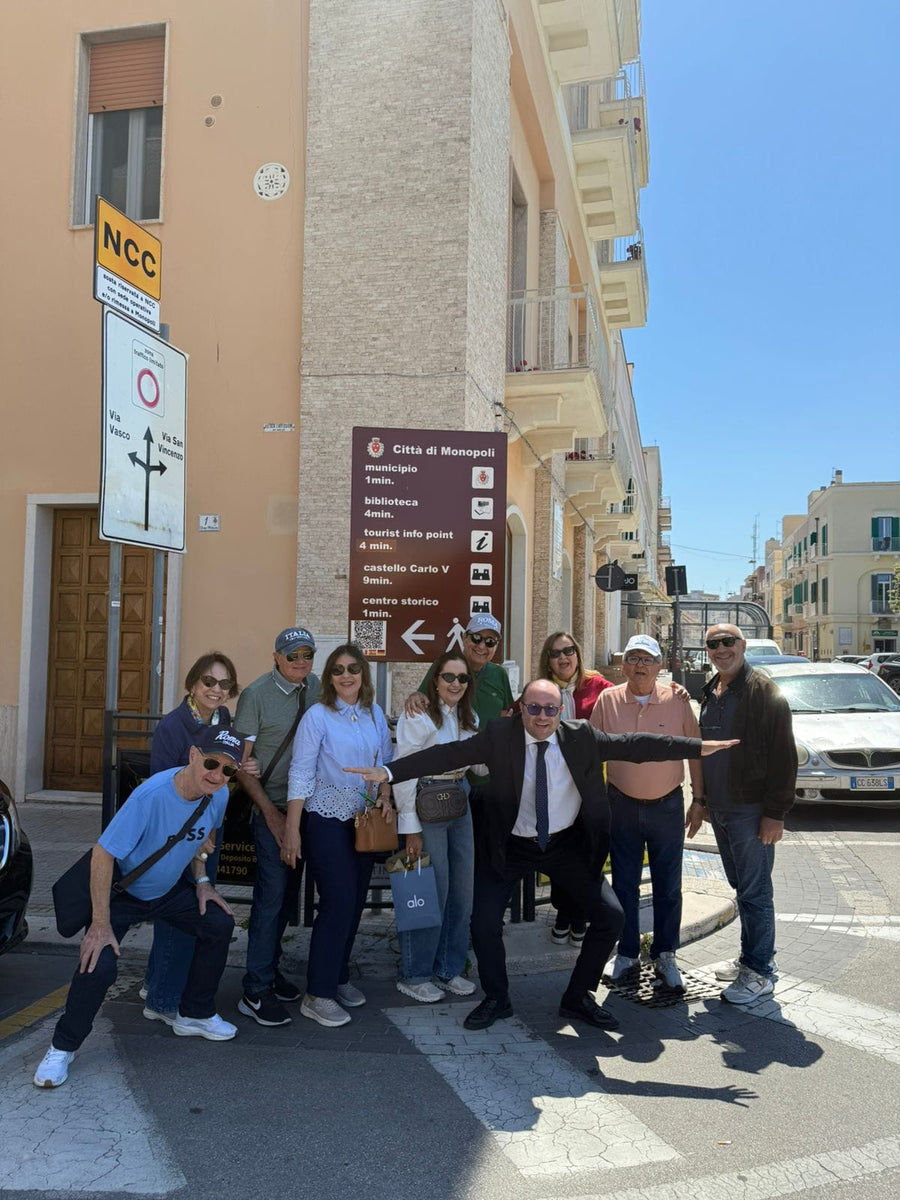 Lorenzo Cappiello and a group in the streets of central Monopoli