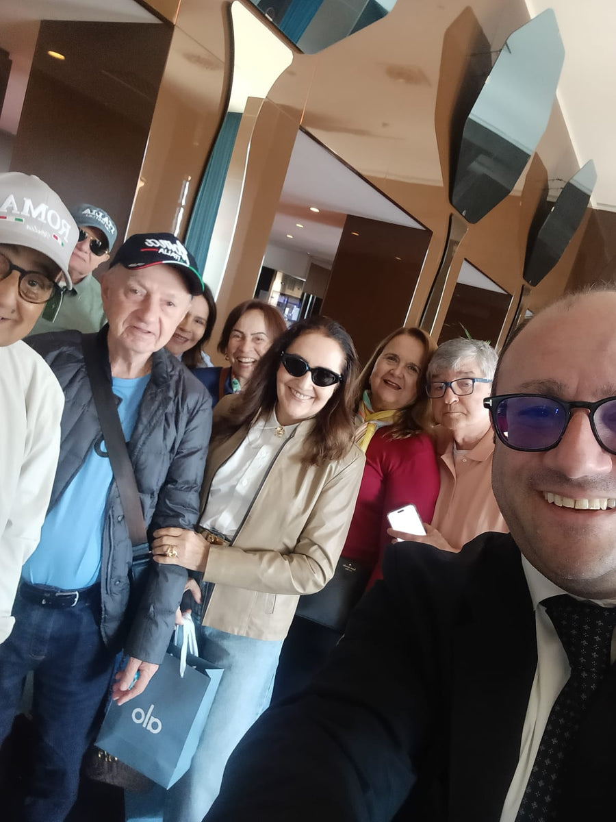 Lorenzo Cappiello taking a selfie with a group of travellers
